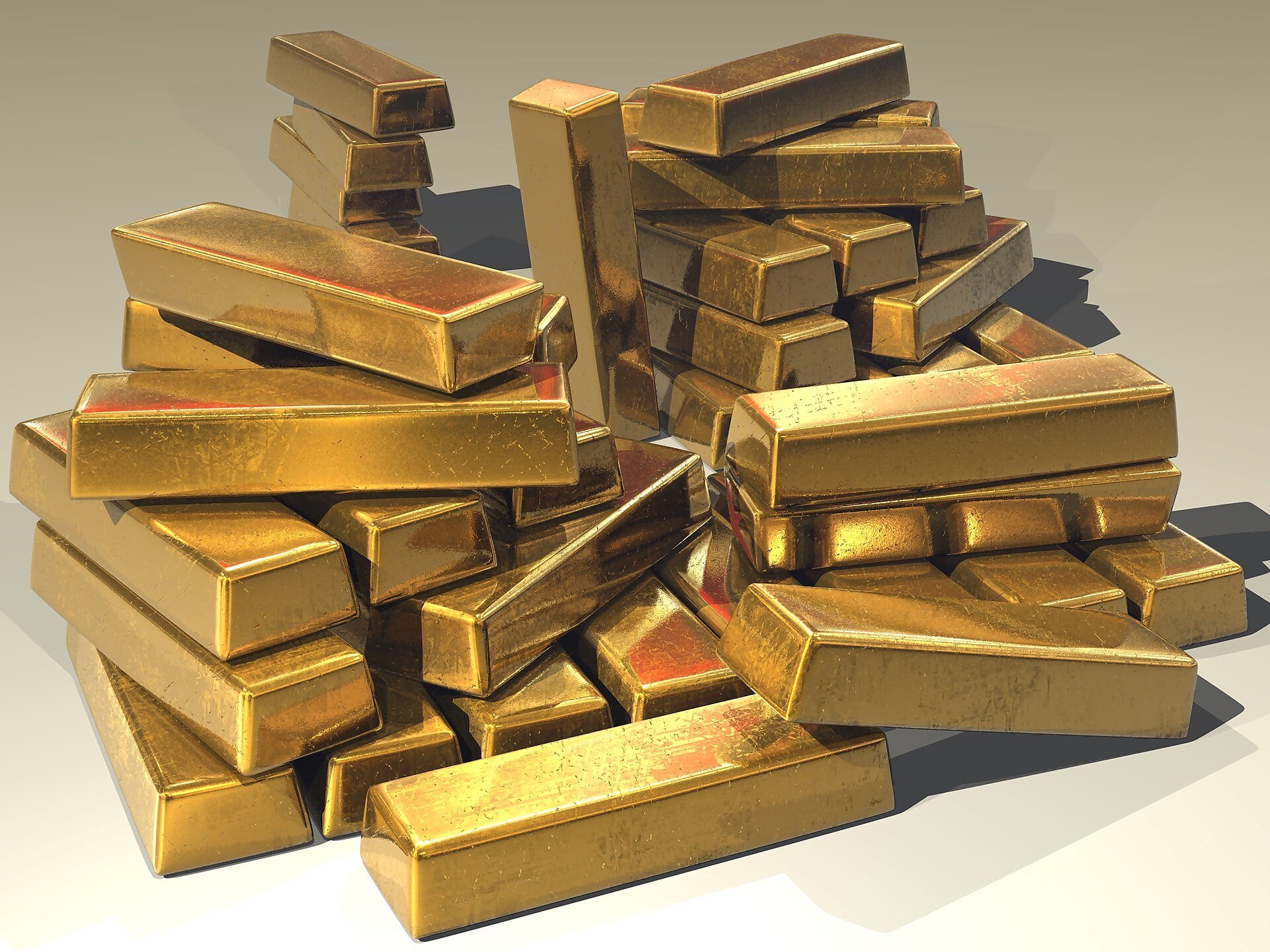 A pile of shiny gold bullion bars