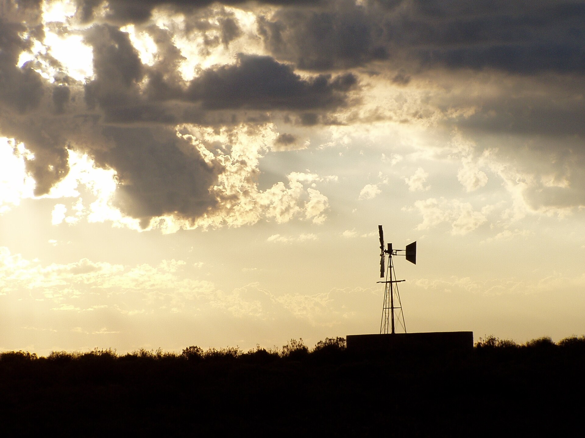 A windpump on a Karoo farm at sunset