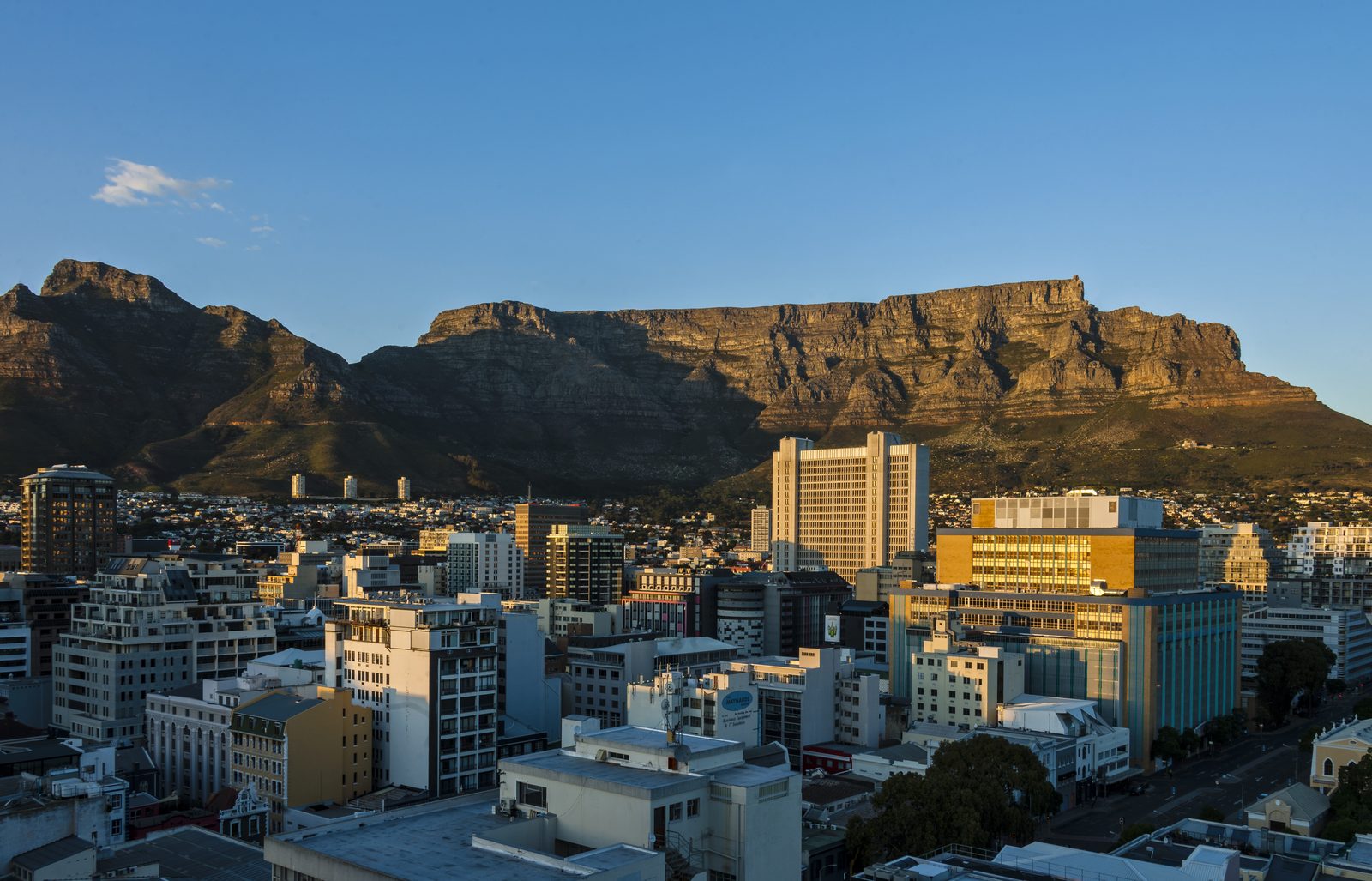 Cape Town's city centre at dawn with Table Mountain behind it